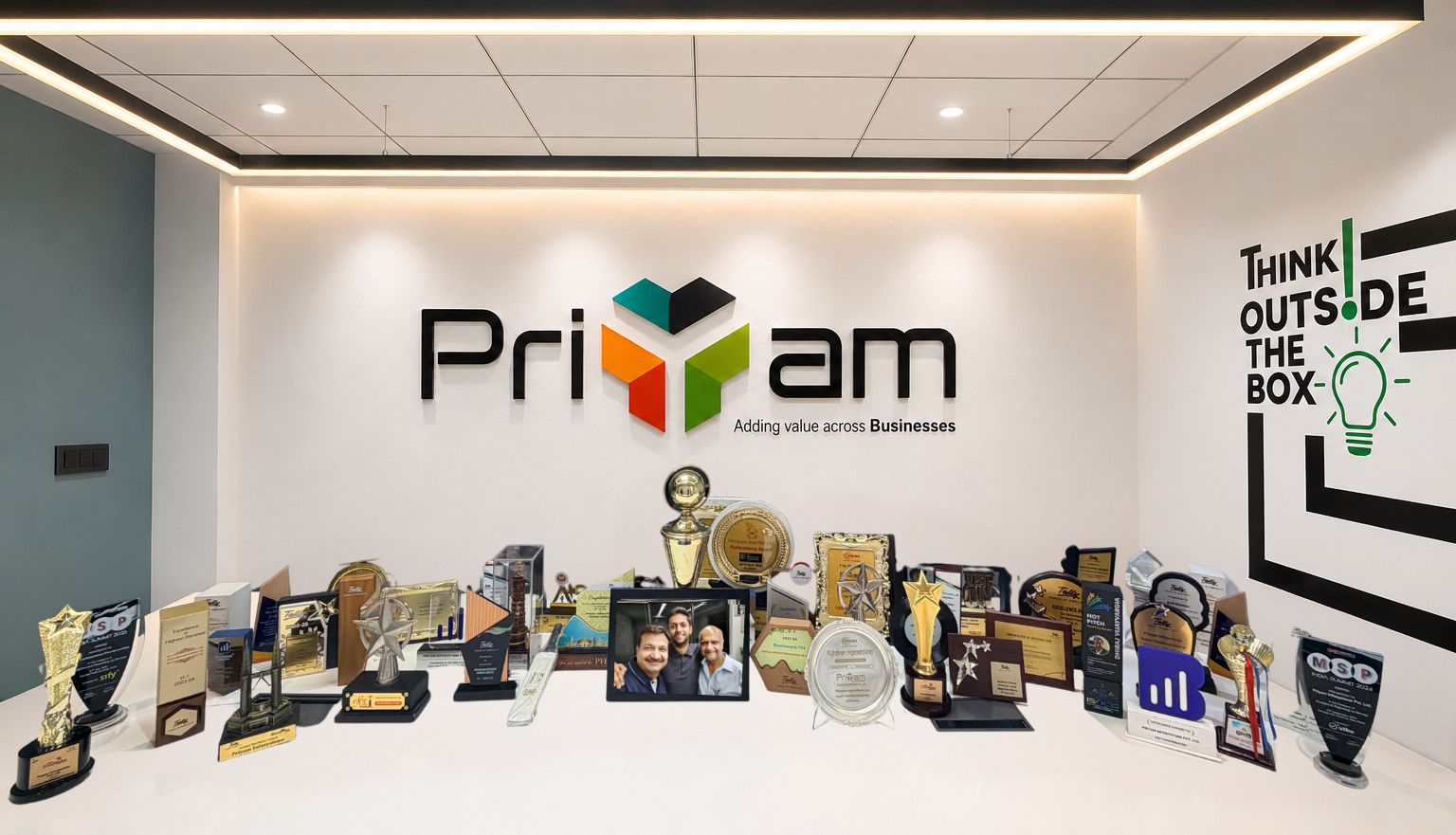 Priyam Infosystems office display featuring awards, trophies and recognitions